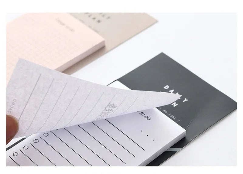 Pink and red schedule planning notepads showing 10cm by 6cm size and 80g paper.