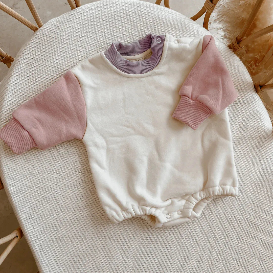 Baby romper in cotton triangle jumpsuit style with hidden hook closure, autumn weight, available in multiple colours