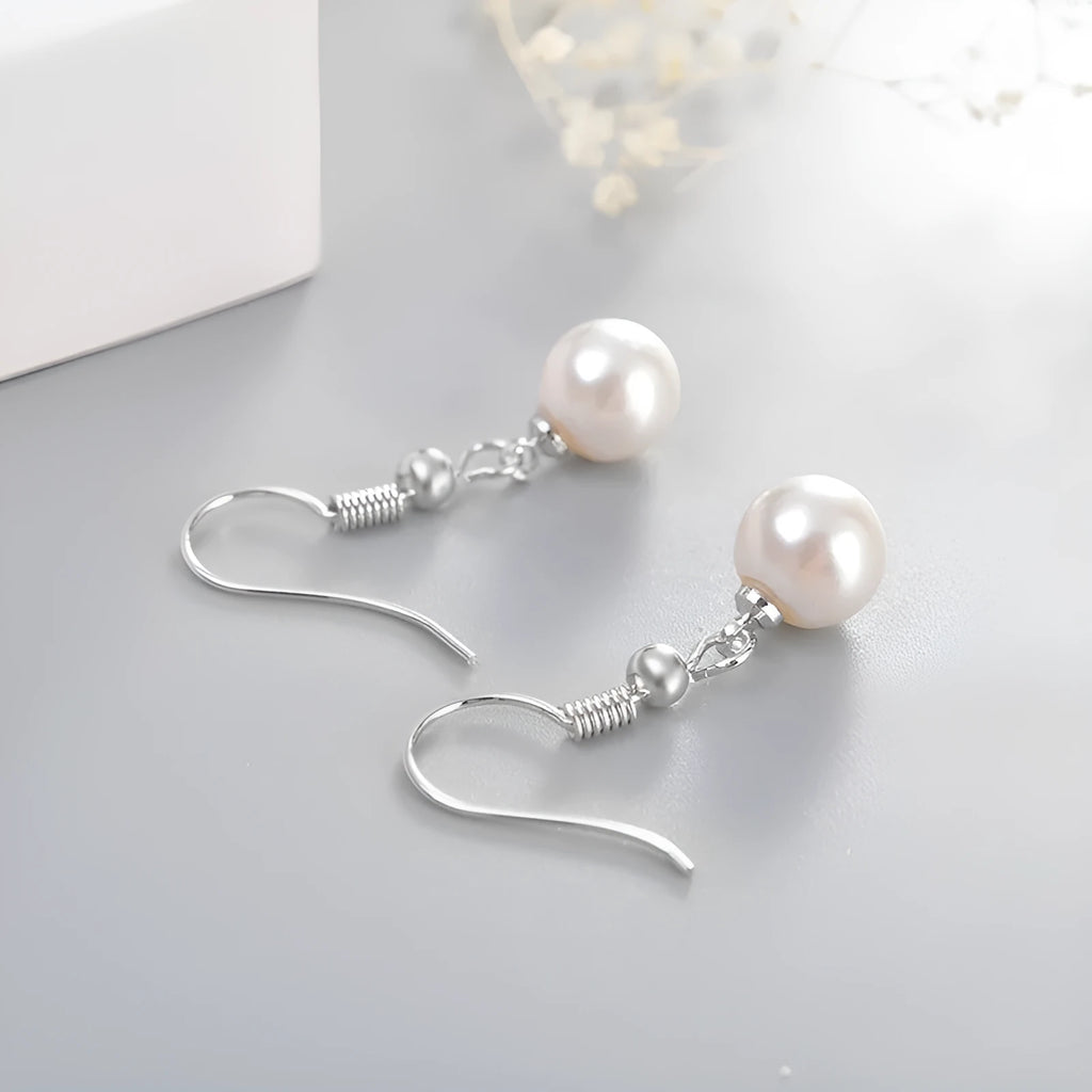 Women's white gold plated geometric high imitation pearl stud earrings on copper base