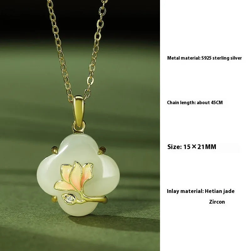 Magnolia flower Hetian jade and sterling silver necklace, bracelet, and earrings set on a white background.