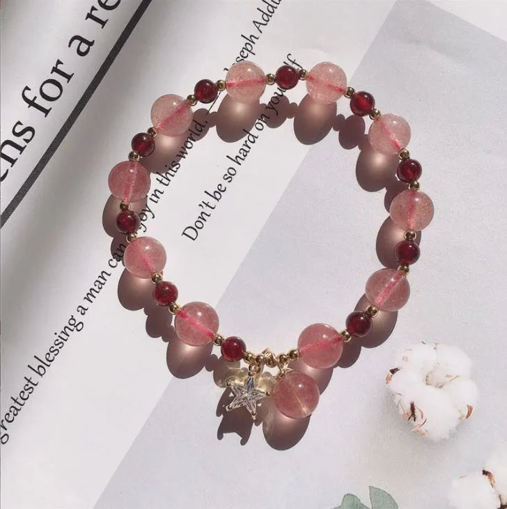 Handmade strawberry quartz crystal bracelet for women showing green strawberry quartz moon design.