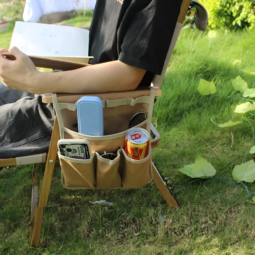 Canvas hanging storage bag for camping and travel, shown in black, beige apricot or green with armrest side attachment