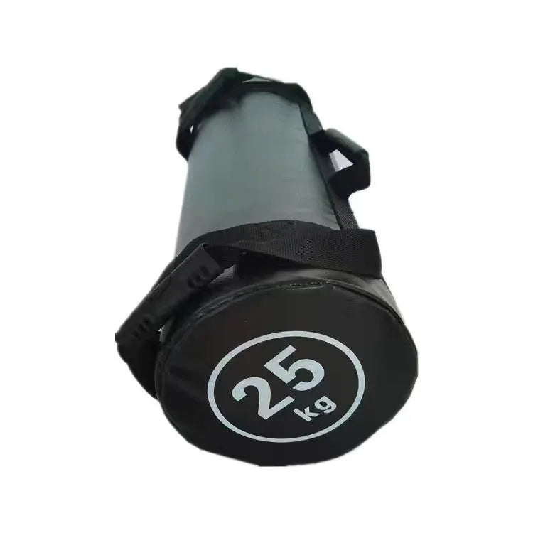 Flat white PVC fitness sandbag on gym floor, showing size and sturdy handles for weight training.