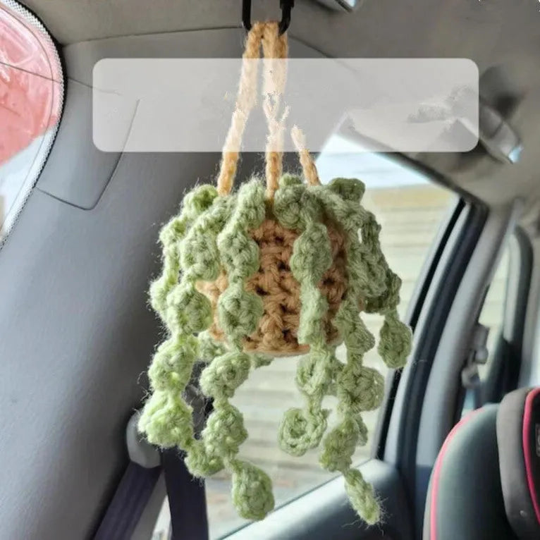 Green and white knitted wool car plant decoration with basin base and hanging rope