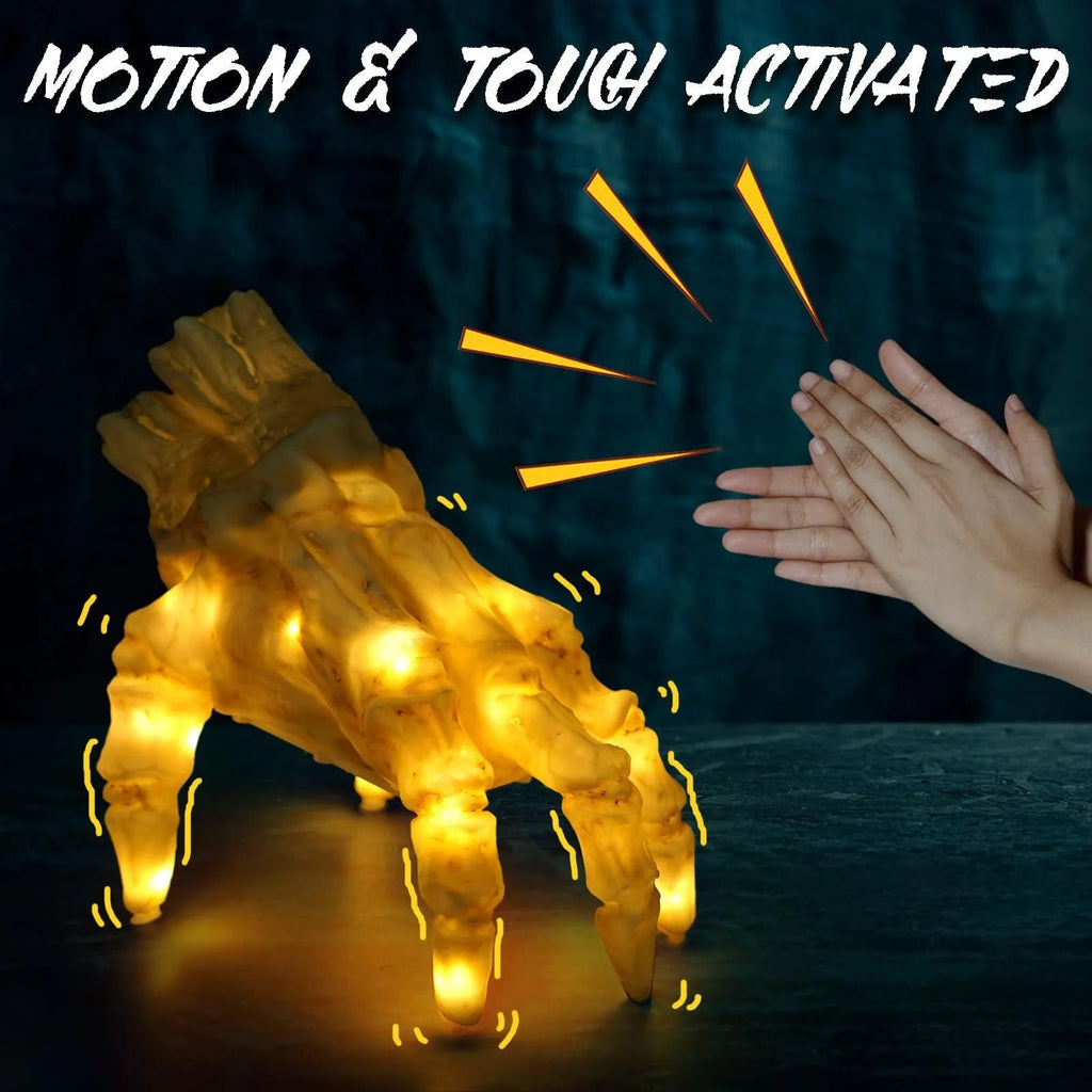 Halloween electric luminous crawling hand on floor, glowing warm colour, vinyl zombie hand with spooky sound