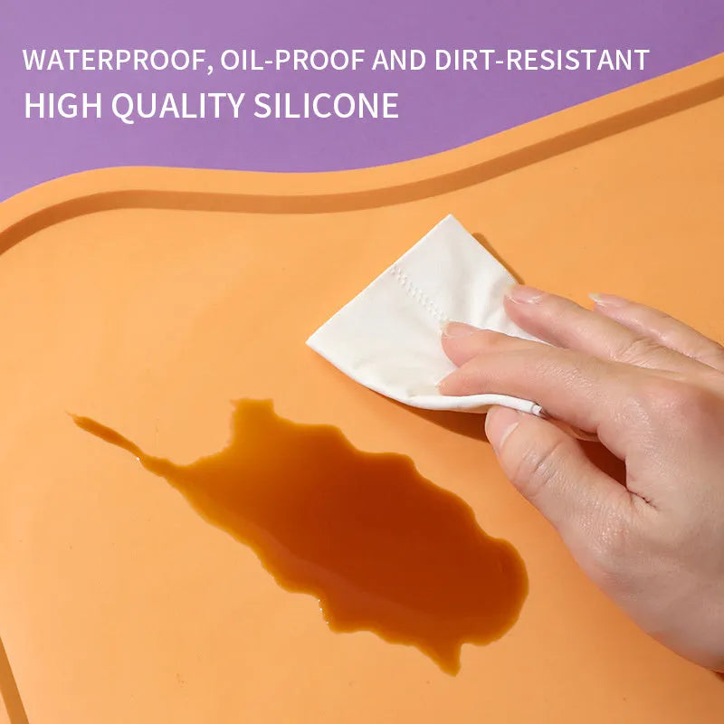 Waterproof silicone dog food mat with raised edges in green colour, non-slip base for pet bowls