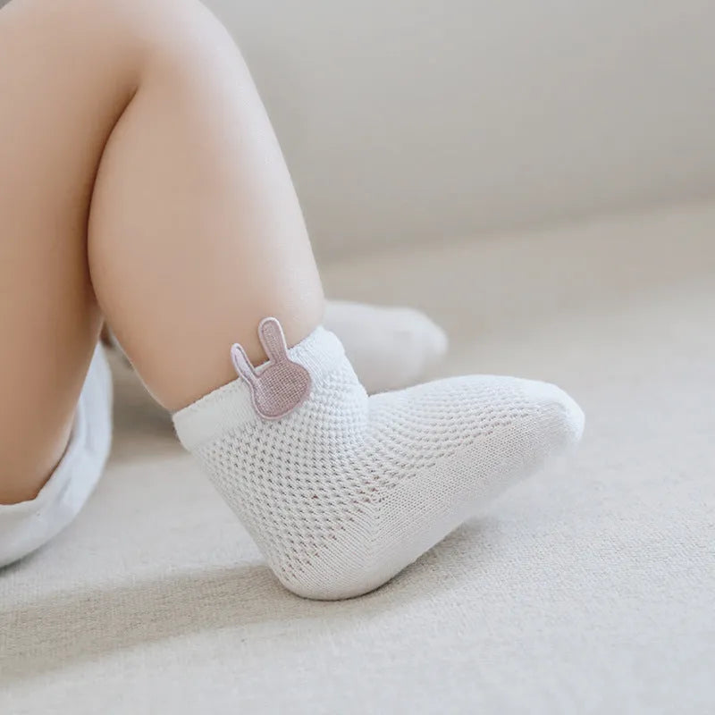 Baby mesh socks in pastel colours, cotton blend, XS to L sizes for 0-5 years, on a white background