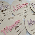 Square wooden baby name label with birth details in one of three style choices.
