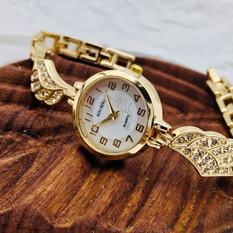 Stainless steel women's watch with round dial showing gold face colour option and vachette clasp buckle