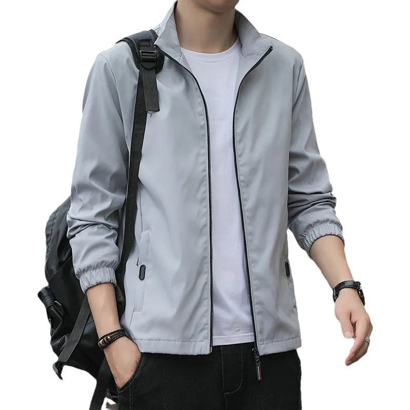 Korean-style loose fit lapel jacket in blue, shown on a model, featuring zipper pockets.