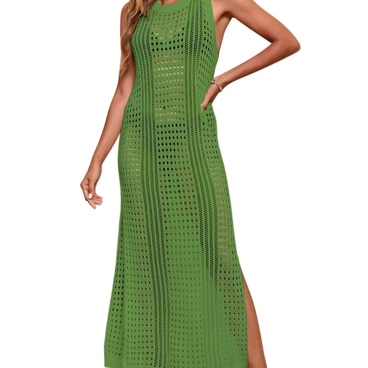 Green hollow-out crochet knitted beach blouse for women on a hanger