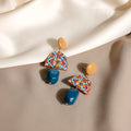 Retro yellow blue contrast acrylic earrings with irregular geometric shapes on white background.