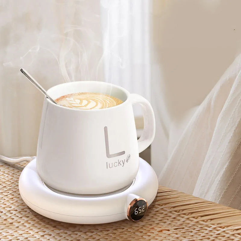 White USB coffee mug warmer plate on wooden desk with measurement showing 130x110mm dimensions