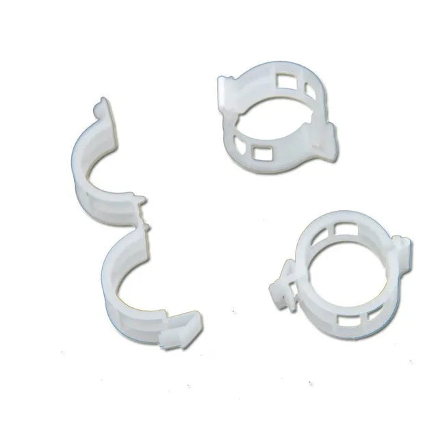 A pack of 50 green plastic garden plant grafting clips for securing tomato stems and tree twigs.