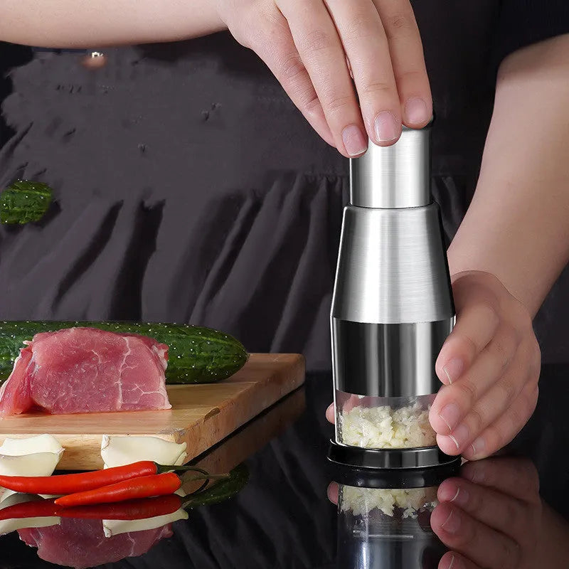 Black manual garlic press and vegetable chopper with stainless steel blades measuring 6x16 cm