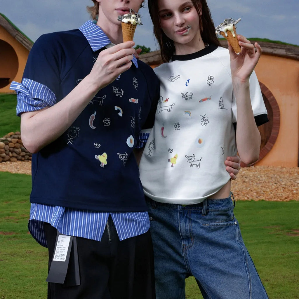 Men's blue and white loose fit short sleeve shirt with cartoon print and contrast colour details.