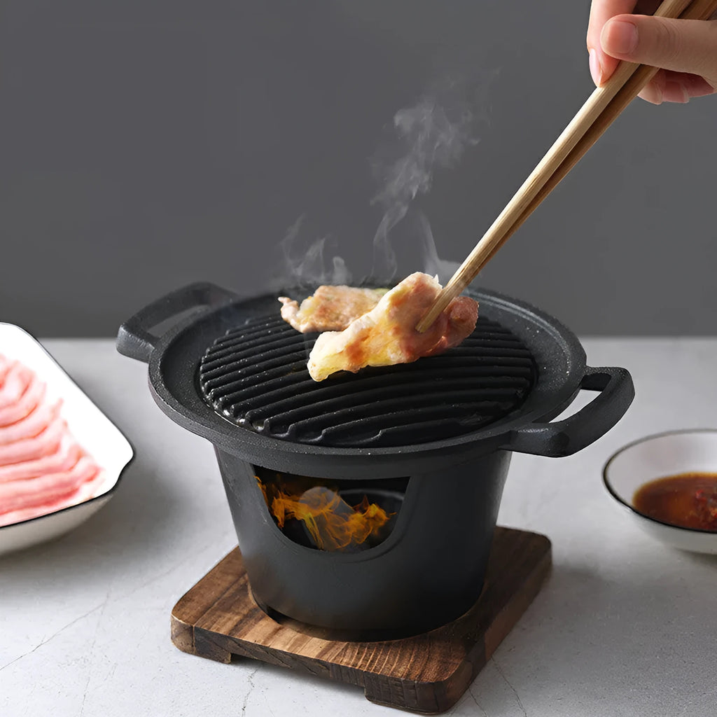 Mini BBQ grill alcohol stove double heads black 18x18x2cm on table with anti-stick plate