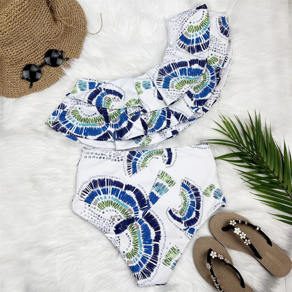 White women's one-shoulder swimsuit with a flounced lotus leaf skirt and high side split.