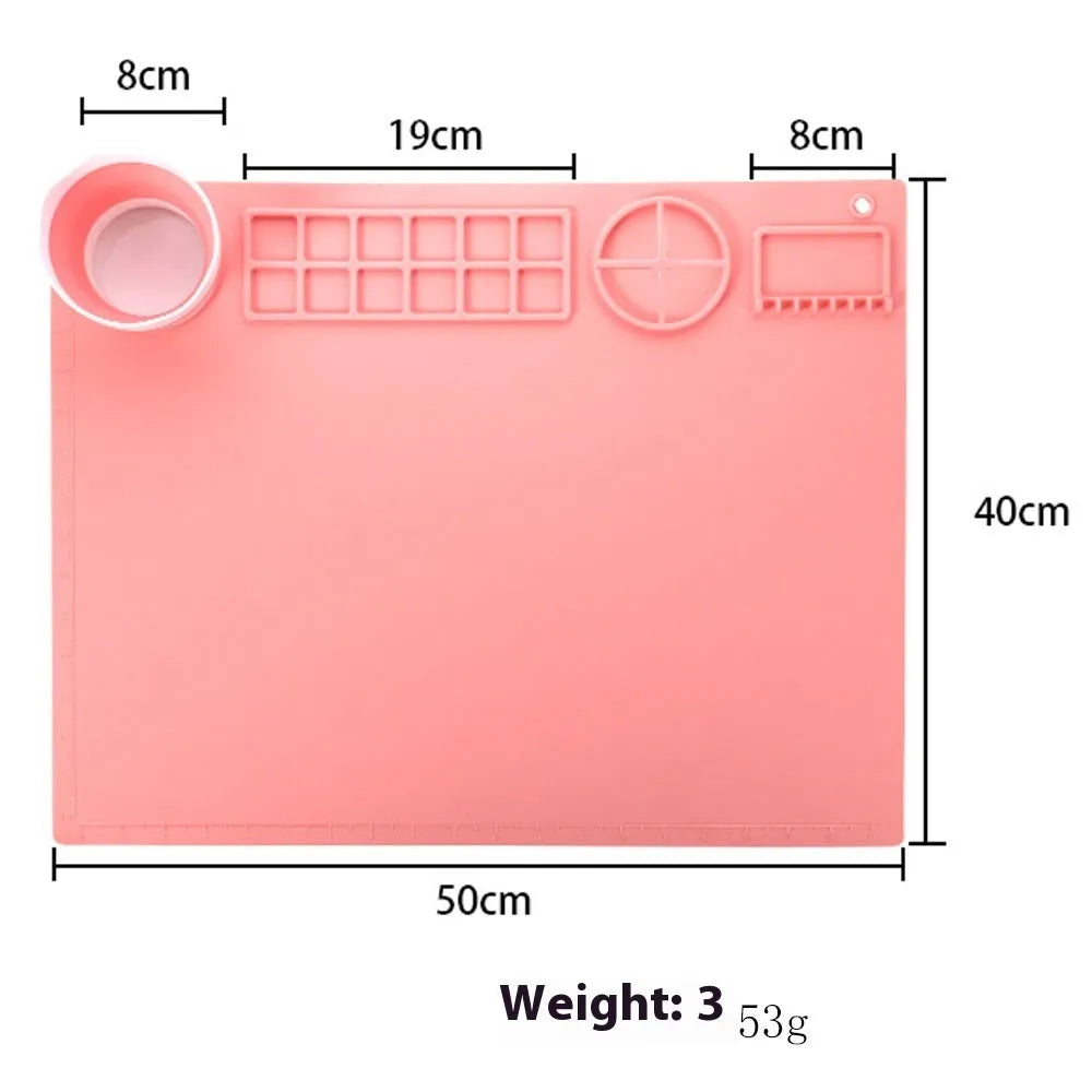 Light blue silicone painting mat measuring 50x40cm with two raised mixing bowls on its surface.