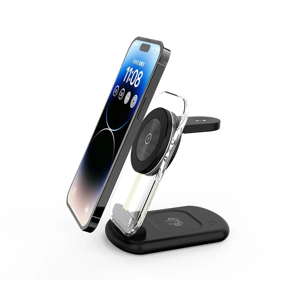 Transparent foldable magnetic wireless charger showing internal coils, unfolded on a table next to a smartphone.