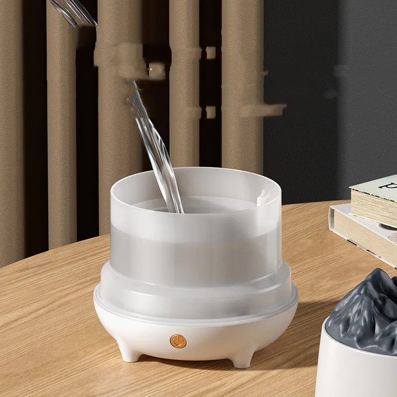 White volcano-shaped ultrasonic humidifier with USB cable for room moisture control