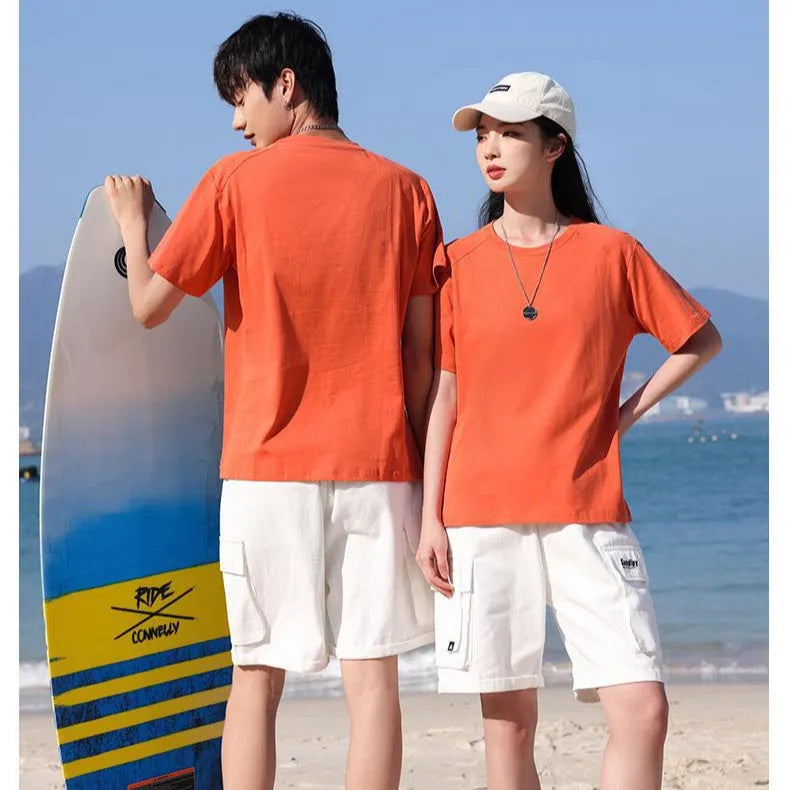 Men's plain pure cotton short sleeve t-shirt on a hanger, shown in multiple solid colours.