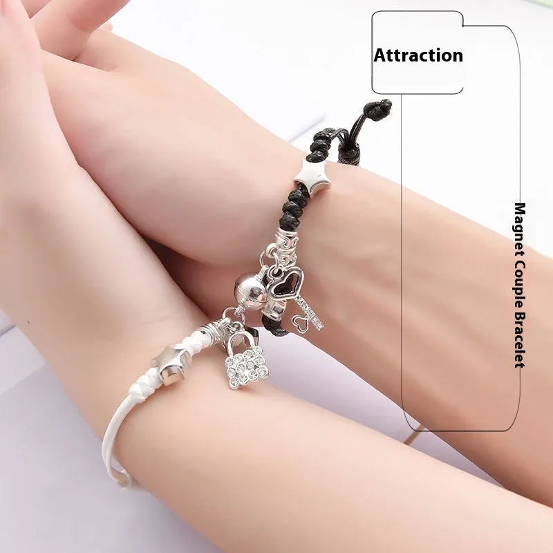 A pair of magnet couple bracelets in alloy with electroplated finish, showing styles like crown, clover, and love lock.