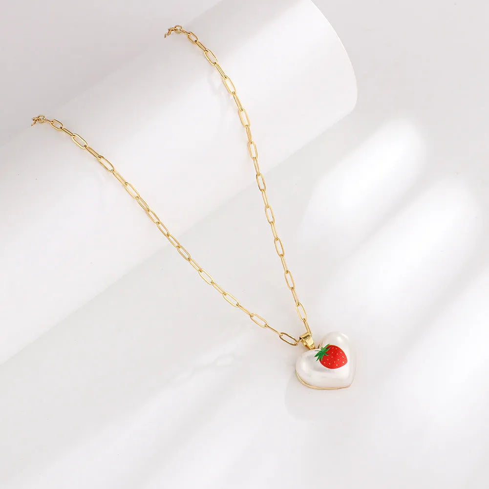 Geometric fruit pendant necklace with adjustable chain showing strawberry pineapple apple pear cherry designs