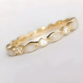 French golden opal open adjustable ring in gold alloy with geometric shape on a white background
