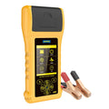Autool BT760 vehicle battery tester with colour screen and attached battery clips on a workbench