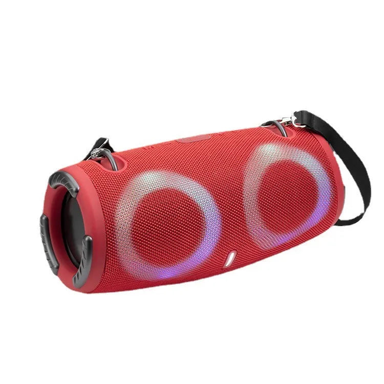 Cylindrical War Drum Bluetooth speaker with coloured RGB lights in a waterproof outdoor setting.