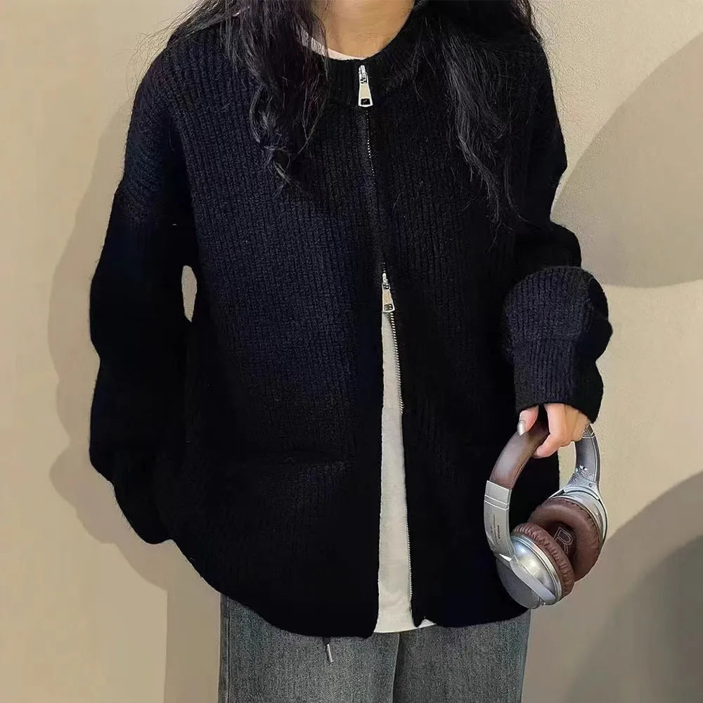 Soft beige viscose fibre sweater coat, a long-sleeve cardigan laid flat.