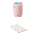 Pink USB desktop humidifier with colourful lights and water tank on wooden surface