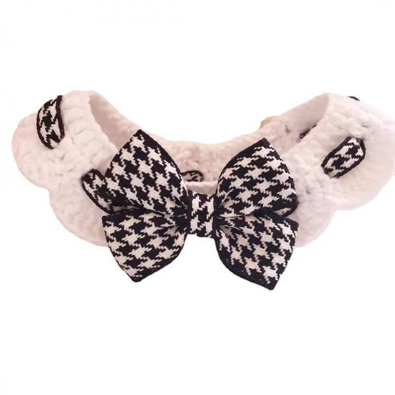 Red houndstooth wool knitted dog collar laid flat showing its pattern and length.