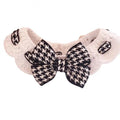 Red houndstooth wool knitted dog collar laid flat showing its pattern and length.