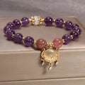 Women's copper bracelet with natural amethyst stones, gold accents, and a longevity lock charm