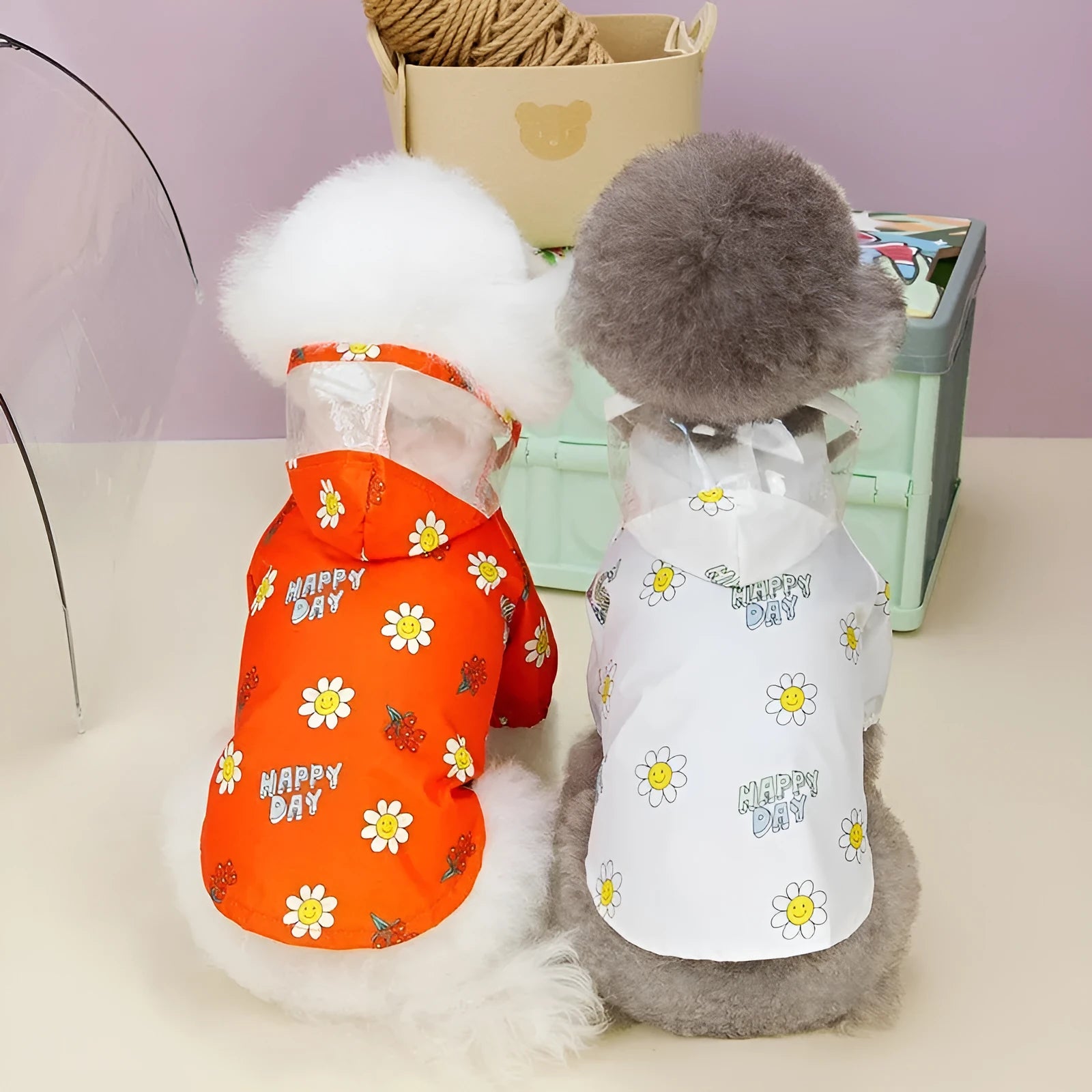 Transparent dog raincoat with small flower print and pull ring traction system