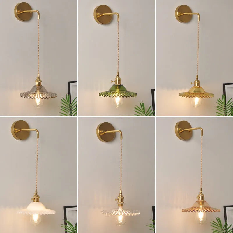 Retro brass lotus wall lamp with adjustable copper wire and white glass shade mounted on a wall.