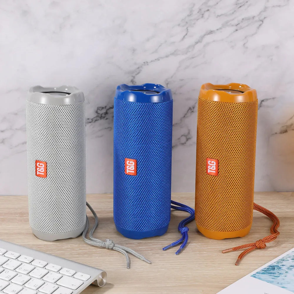 Blue portable Bluetooth speaker with integrated card holder, showing front and side views.