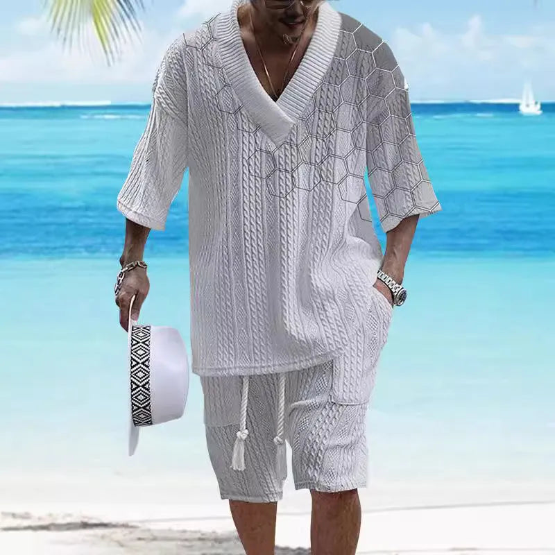 Man wearing a printed drop-shoulder knitted short-sleeve top with matching shorts.