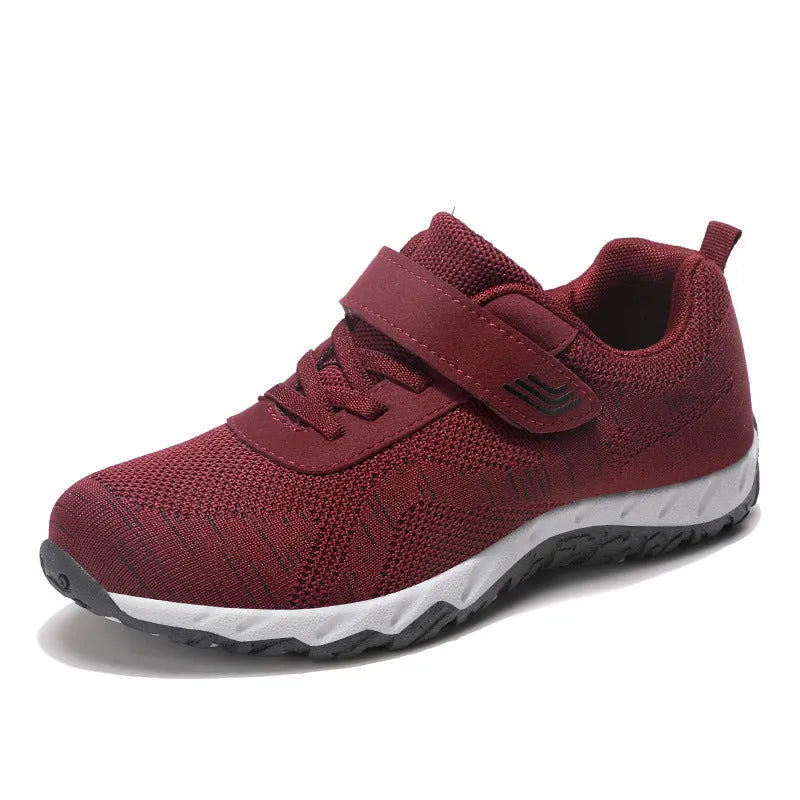 Women's low-top casual shoes with Velcro strap, wedge heel, and breathable mesh upper in a grey purple colour.