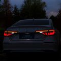 Black and red modified LED taillight assembly for 11th Generation Honda Civic with streamer lights.