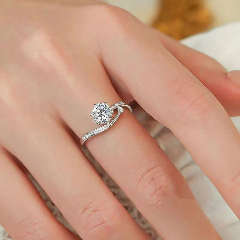 S925 sterling silver starry track ring with 1-karat oval plum blossom cut moissanite stone on white background