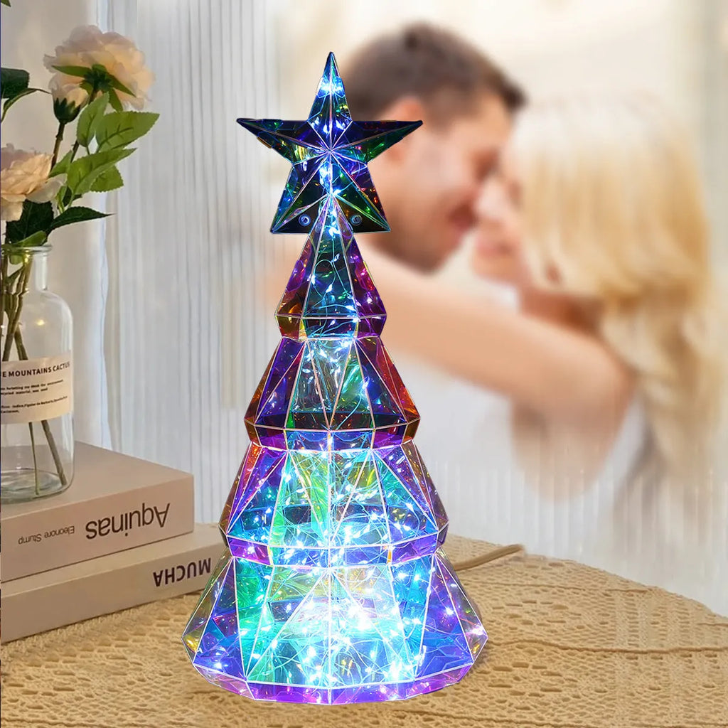 Colourful cartoon-style Christmas tree light decoration measuring 20cm high on a table.
