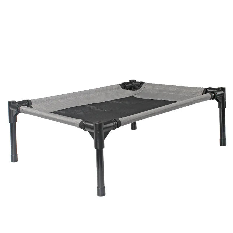 Black portable outdoor dog bed with removable washable cover and steel frame, shown on grass.