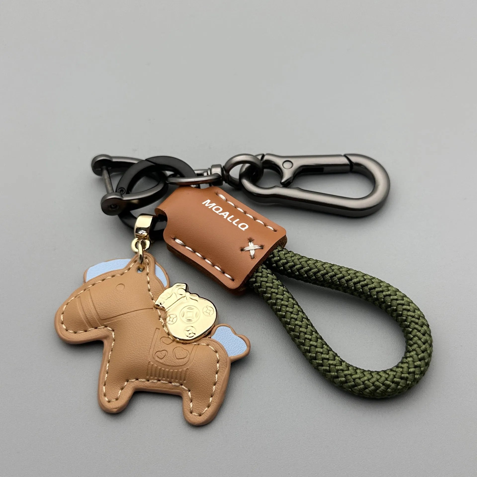 Handmade cowhide car key ring pendant with zinc alloy pony belt buckle on a colourful flanelle rope.