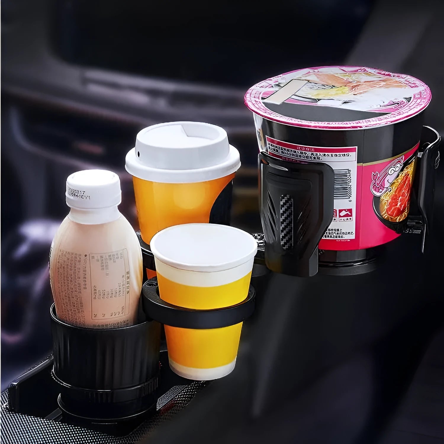 Black retractable car cup holder with adjustable base on a flat surface
