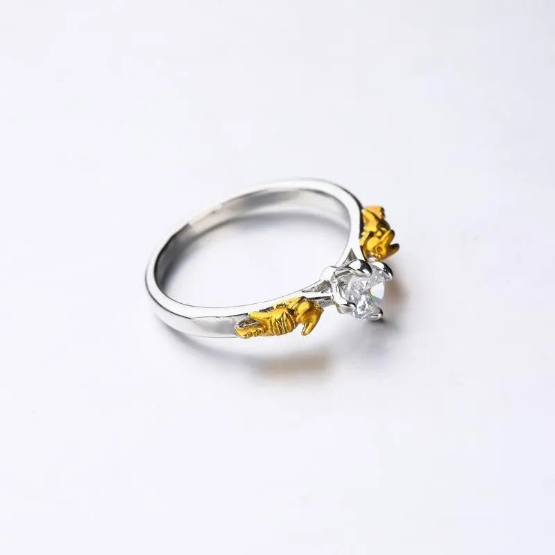 Close-up of a black gold plated crown ring on a finger, showing detailed copper modelling and a dark metallic finish.