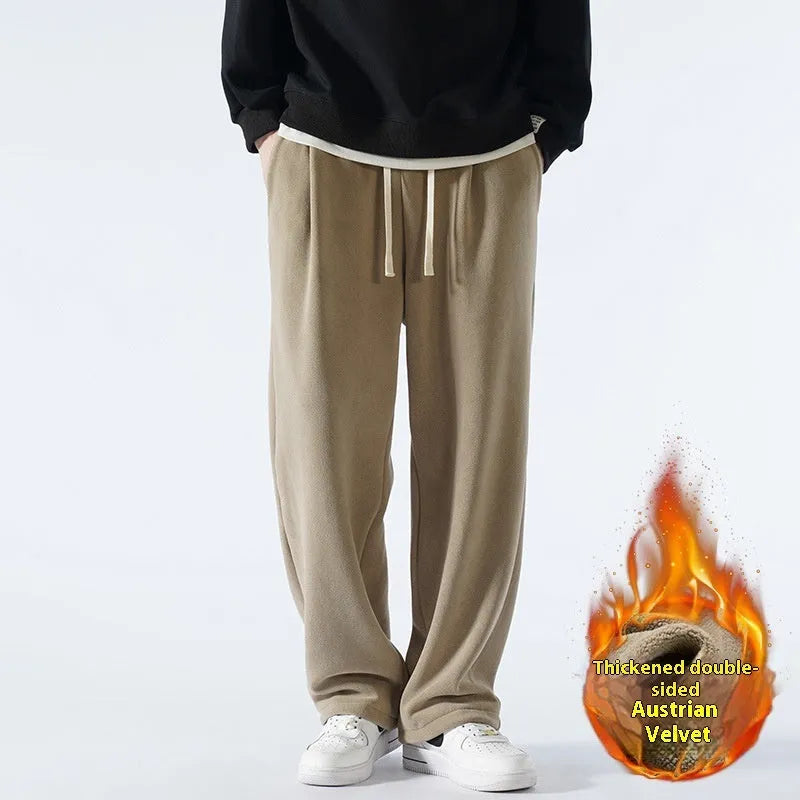 Men's apricot coloured loose-fit polar fleece winter sports pants with a drawstring waist.