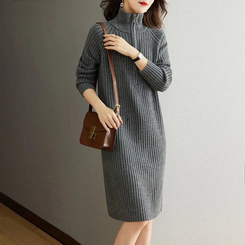 Beige half-zip woollen midi dress with long sleeves and a stand collar, laid flat.